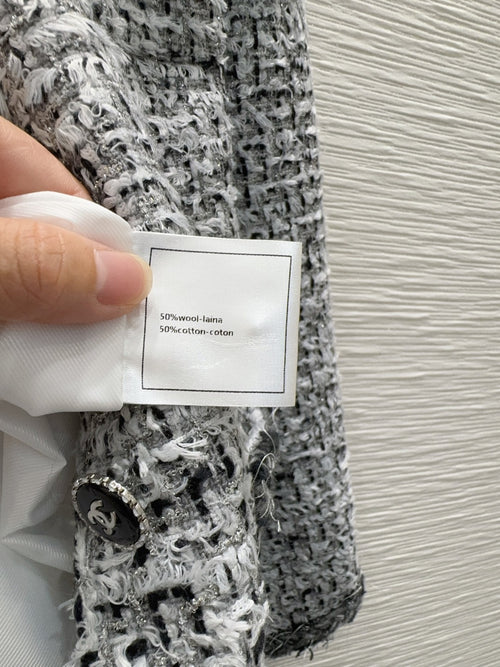 gray and black woven tweed jacket