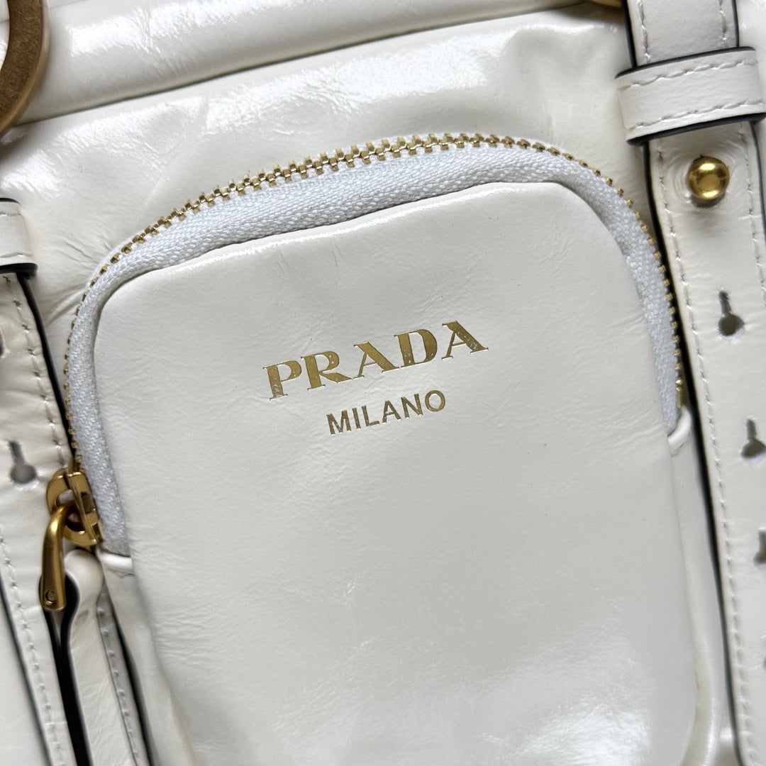Prada Pre-Owned
2025 Medium Leather Dangle Top Handle Bag shoulder bag