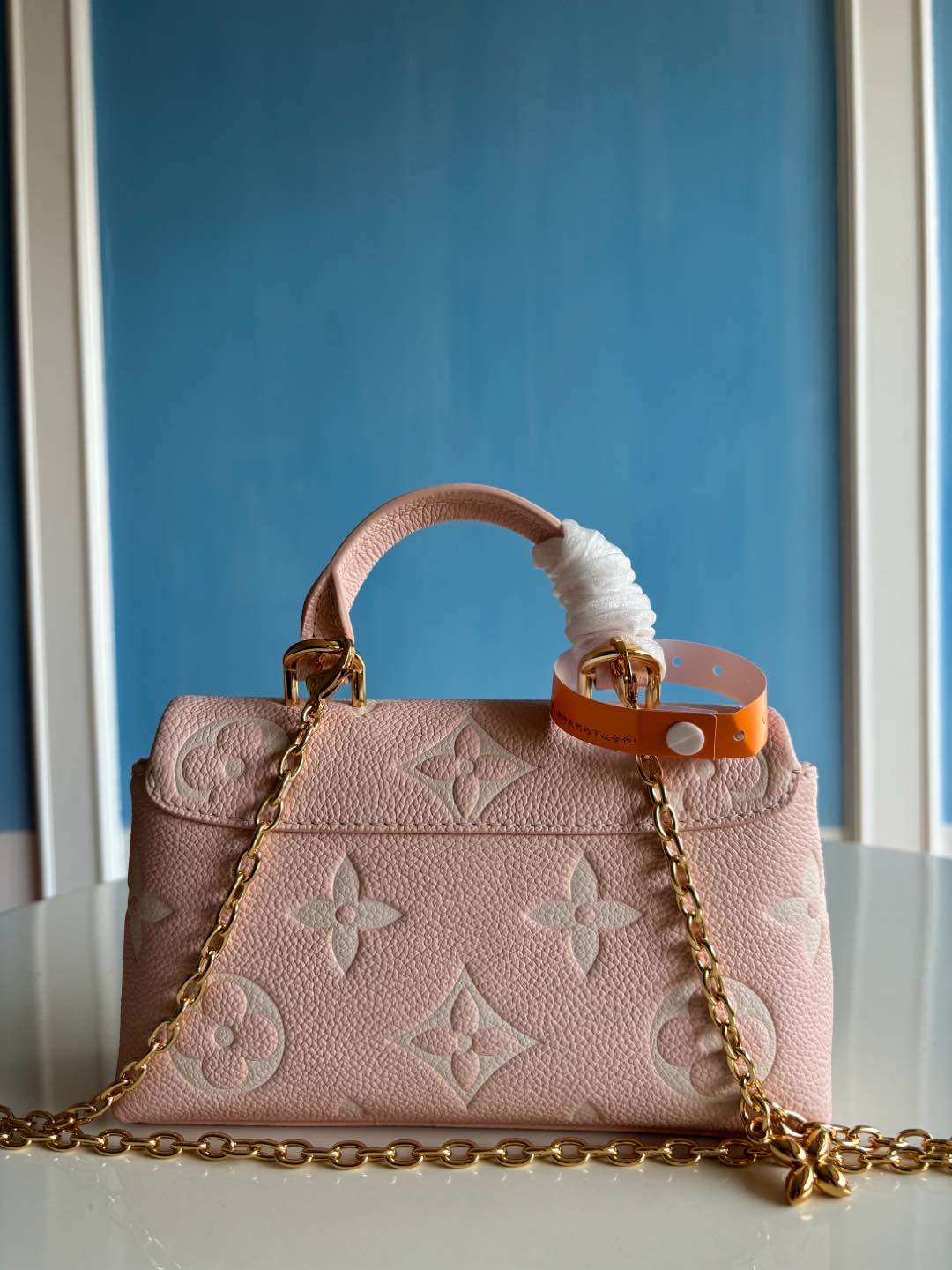 Louis Vuitton Empreinte Monogram Giant Madeleine Nano Rose White Quartz - Styledbyblazz